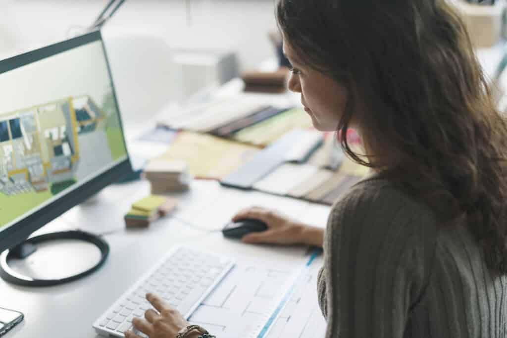 Interior designer working on computer using cloud storage