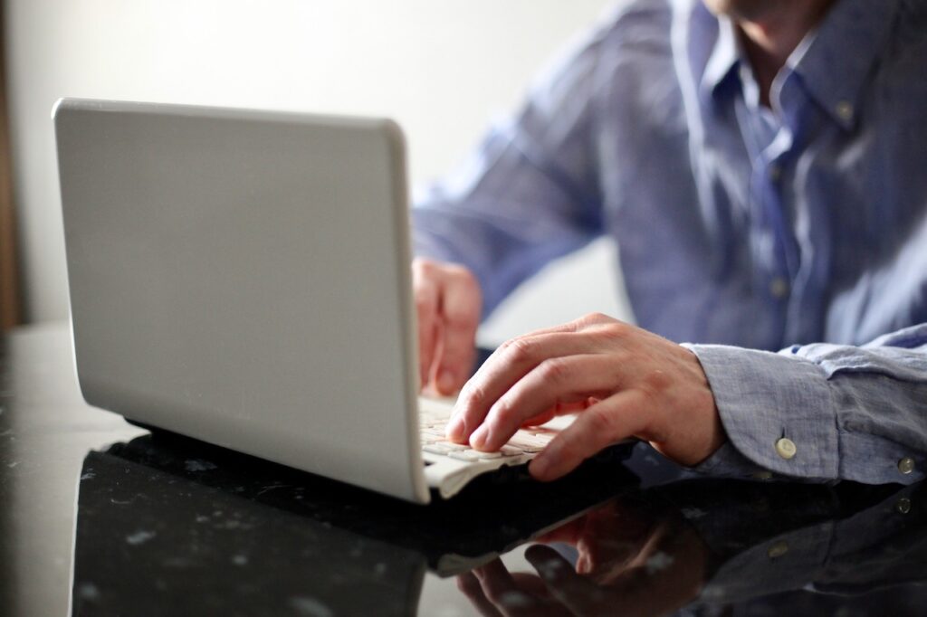 employee using laptop using nist cybersecurity framework