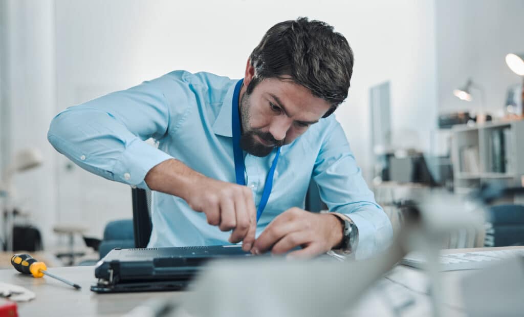 engineer fixing computer hardware