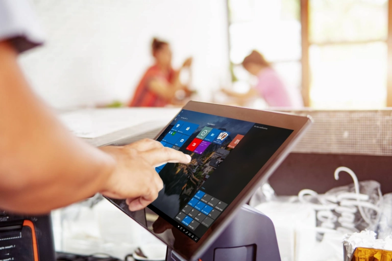 Digital tablet point of sale system being operated by hand
